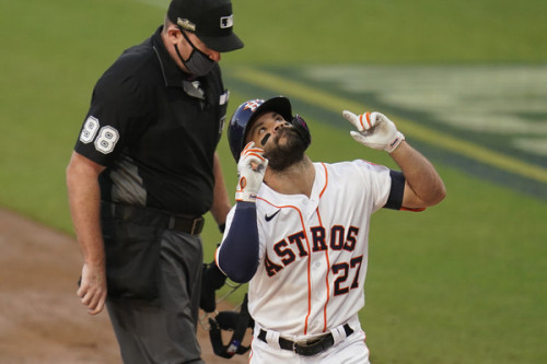 Houston Astros' Jose Altuve celebrates after hitting a solo home run against Tampa Bay Rays pitcher 